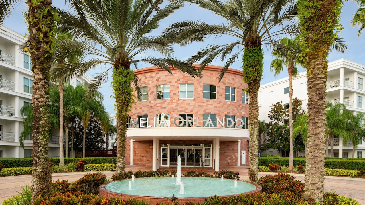 A brick building with a sign that says ‘Melia Orlando’